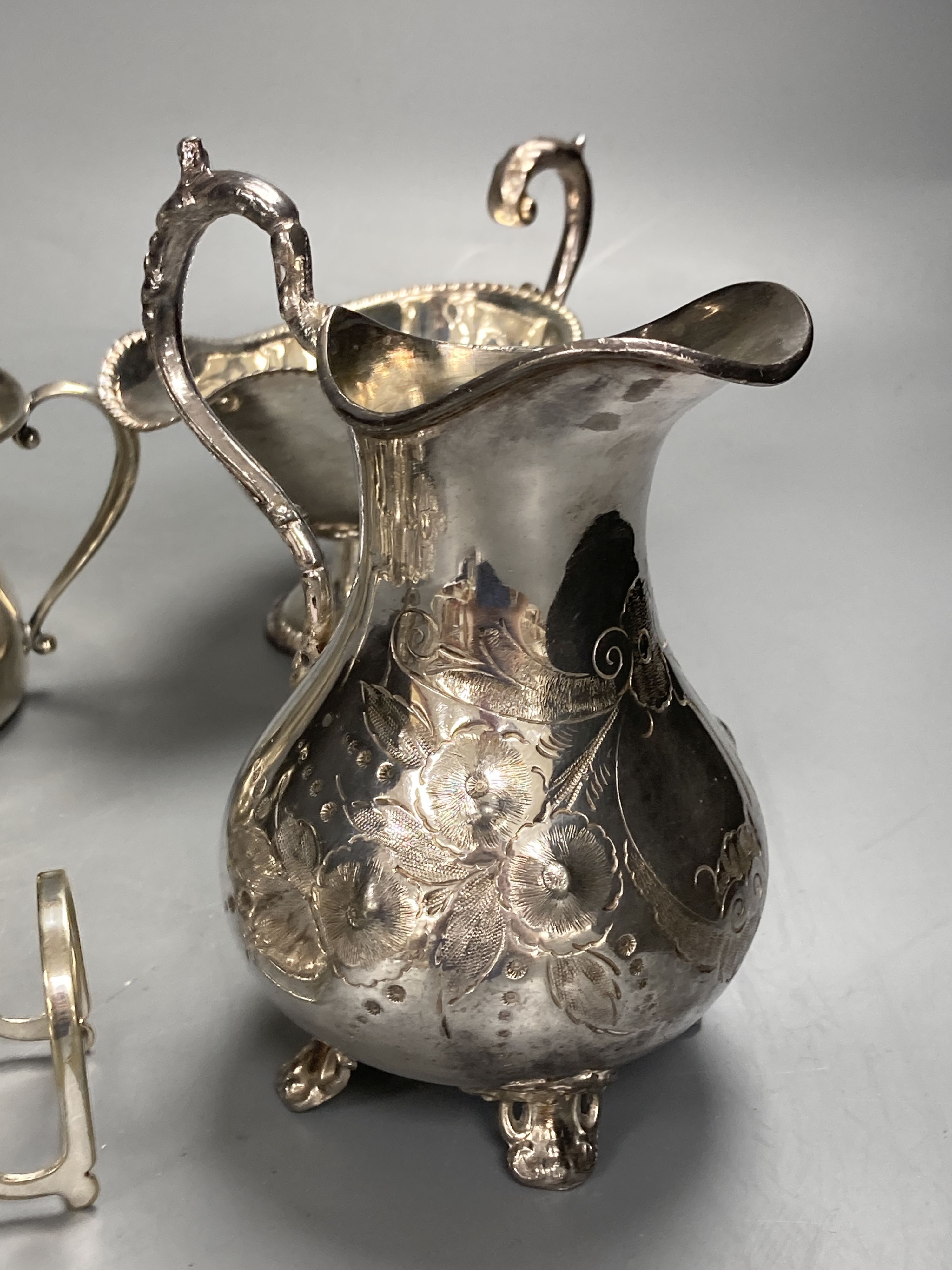 A sterling mug, a silver bonbon dish, a white metal strainer and a group of minor plated items.